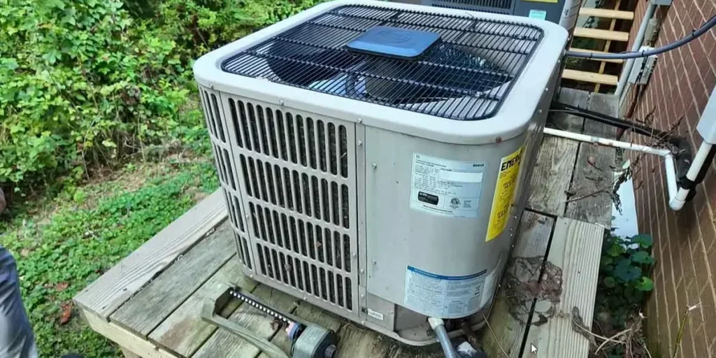 HVAC technician diagnosing a residential system for a Sugar Land homeowner