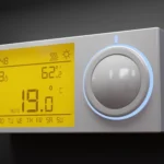 Modern digital home thermostat display illustrating what does aux mean on a thermostat during auxiliary heat activation.