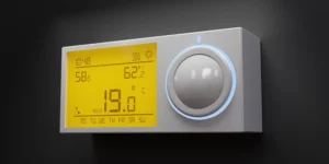 Modern digital home thermostat display illustrating what does aux mean on a thermostat during auxiliary heat activation.
