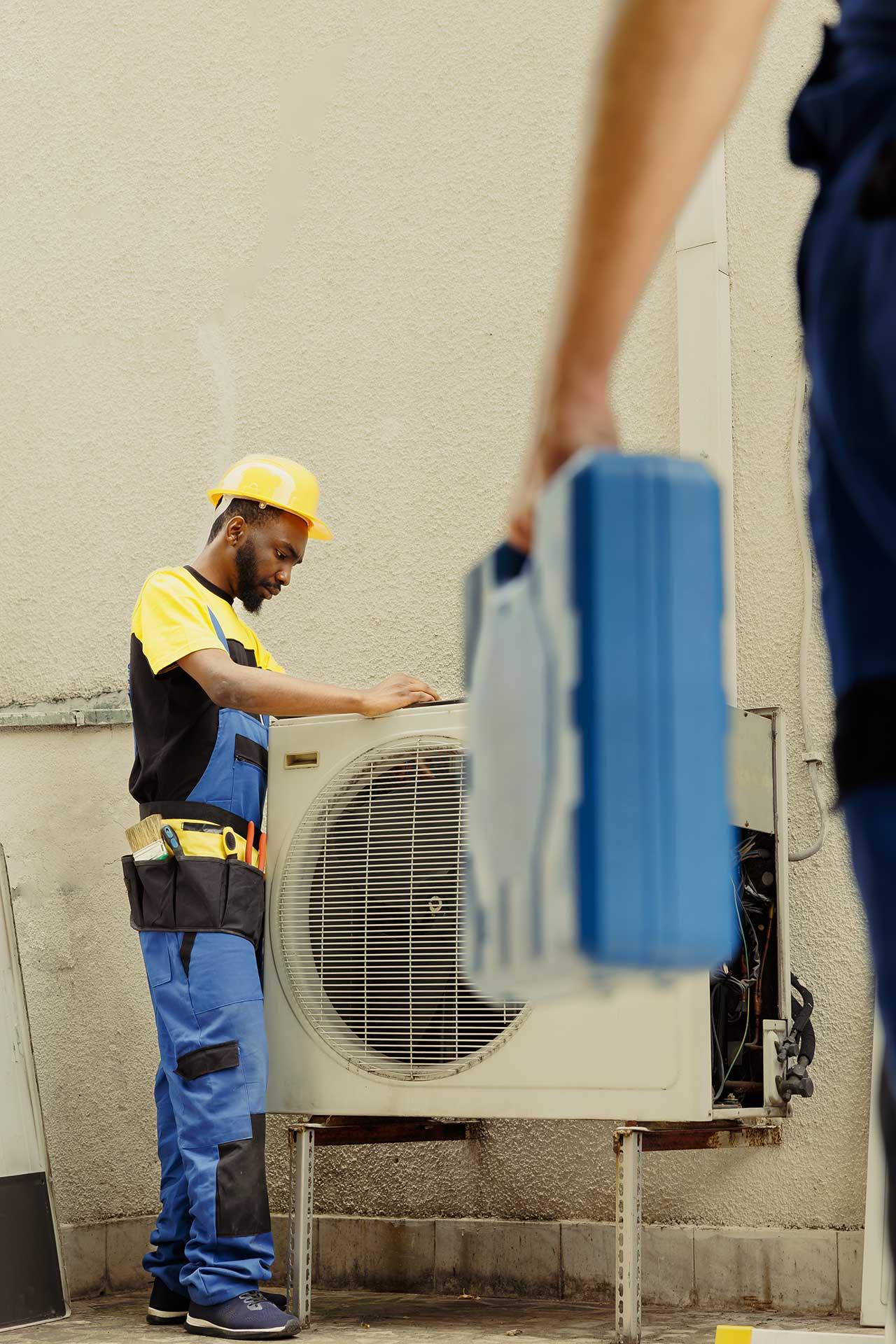 HVAC technician performing comprehensive AC tune-up inspection in Houston home