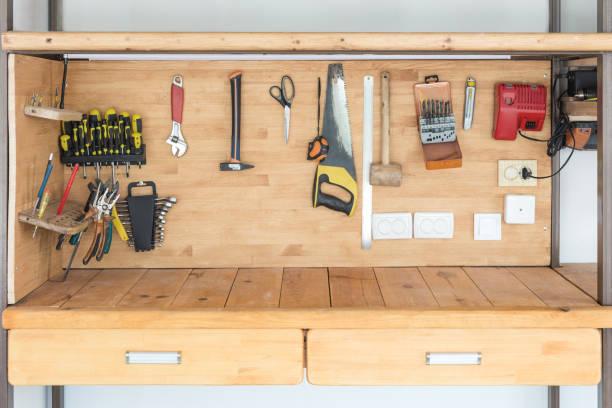 Essential DIY AC maintenance tools laid out on workbench