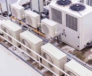 Role Air Purifiers Play Within Modern HVAC Systems shown through commercial HVAC units supporting