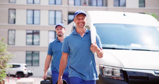 Experienced HVAC team with service vehicles