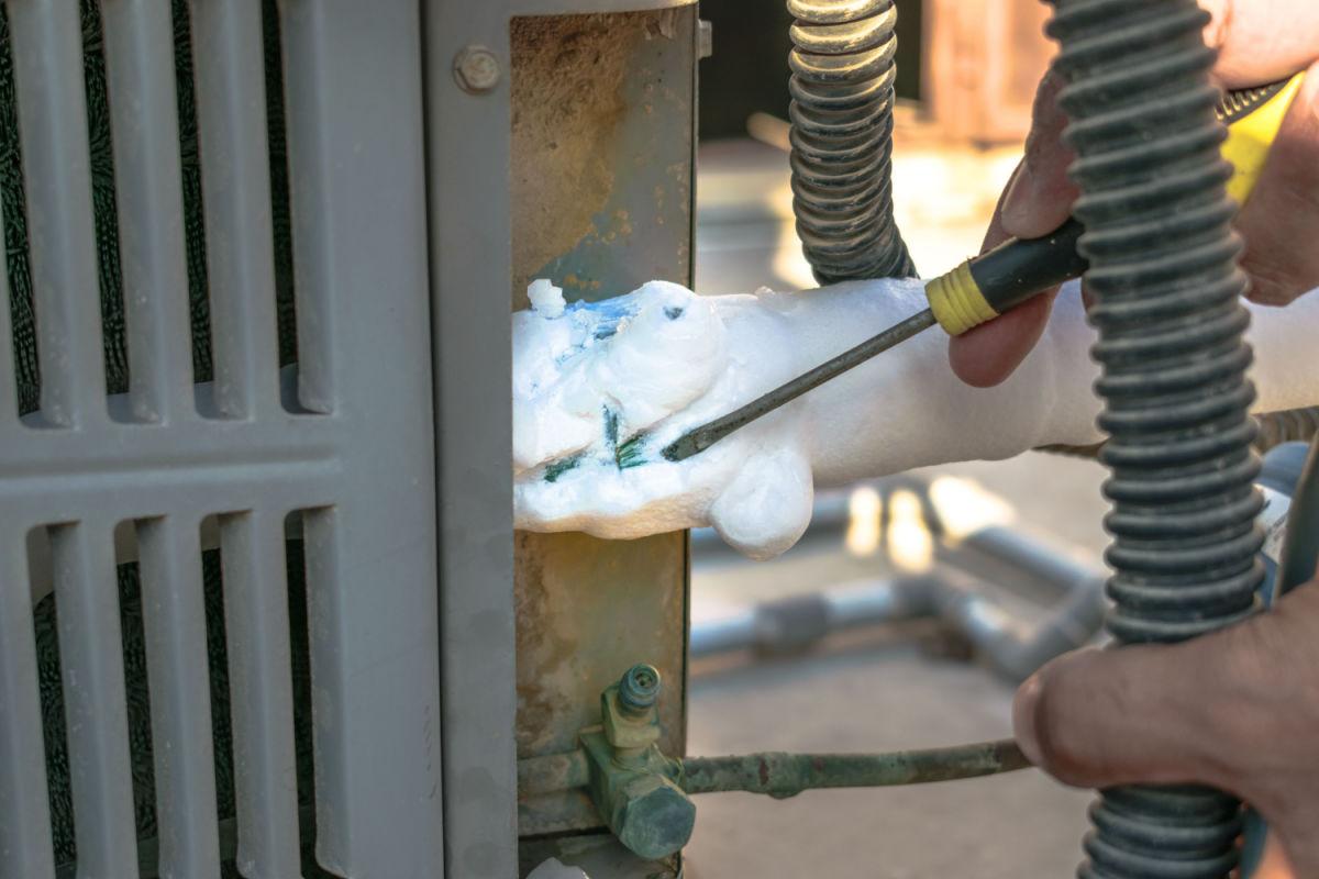 Frozen AC evaporator coil requiring professional repair