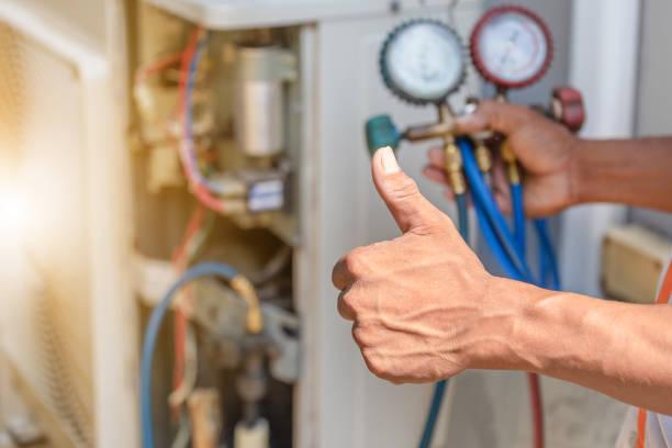 Professional HVAC technician performing furnace maintenance