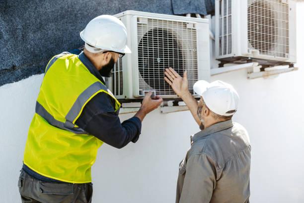 Homeowner asking questions to HVAC technician