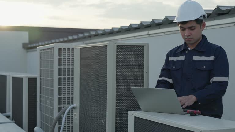 Homeowner researching AC repair companies on laptop