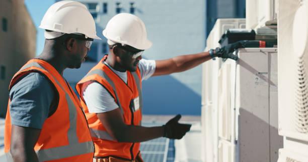 HVAC technician showing certification credentials
