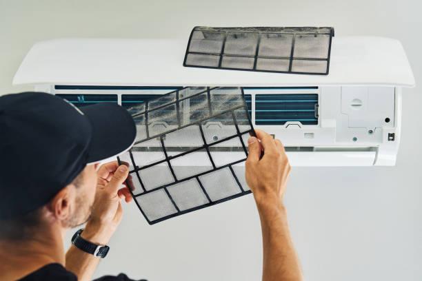 HVAC Technician Measuring AC Airflow