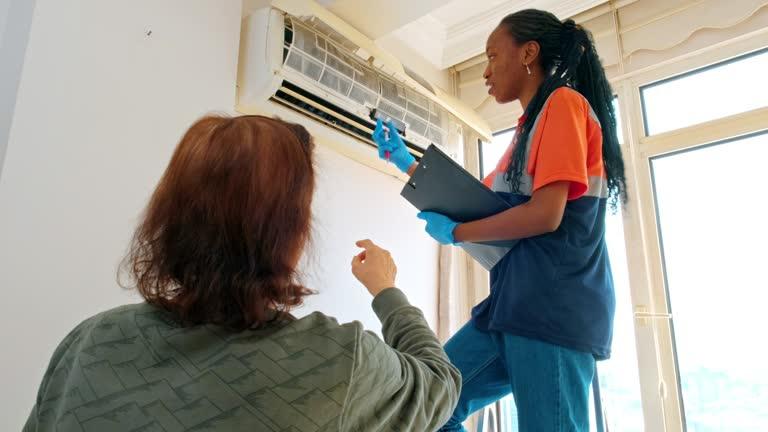 HVAC professional discussing options with homeowner