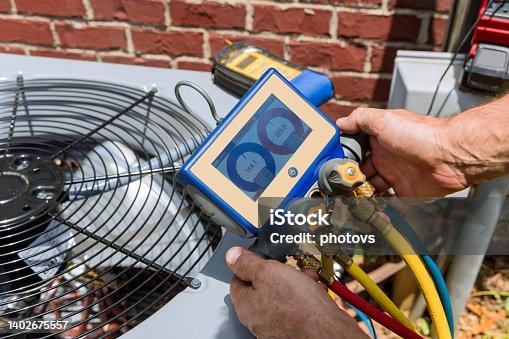 HVAC Technician Using Advanced Diagnostic Equipment