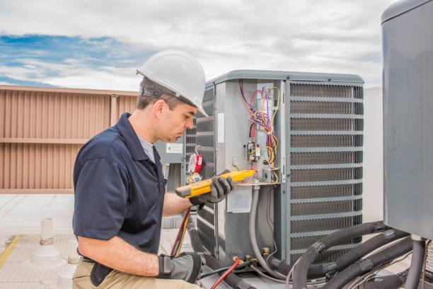 HVAC technician using professional diagnostic tools