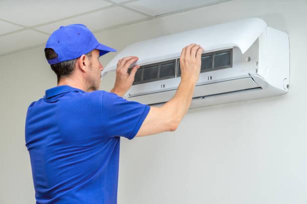 Professional HVAC Technician Performing Central AC Repair