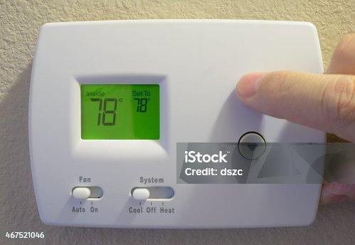 Digital thermostat showing temperature inconsistency in Houston home